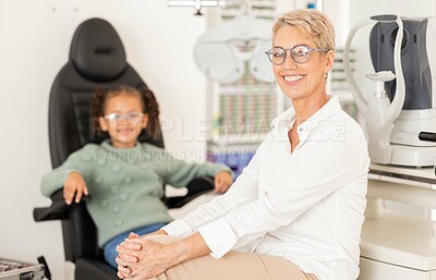 Buy stock photo Ophthalmologist, child patient and vision test or eye exam for eye care to check and examine eyesight at a clinic or optometry store. Portrait of woman doctor or specialist ready for optics care