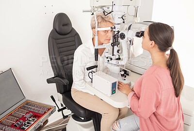 Buy stock photo Eyes, exam and woman with ophthalmologist on a slit lamp for vision, testing and consulting at a clinic. Healthcare, medical and eye doctor with patient in visual examination, eye and eyesight 
