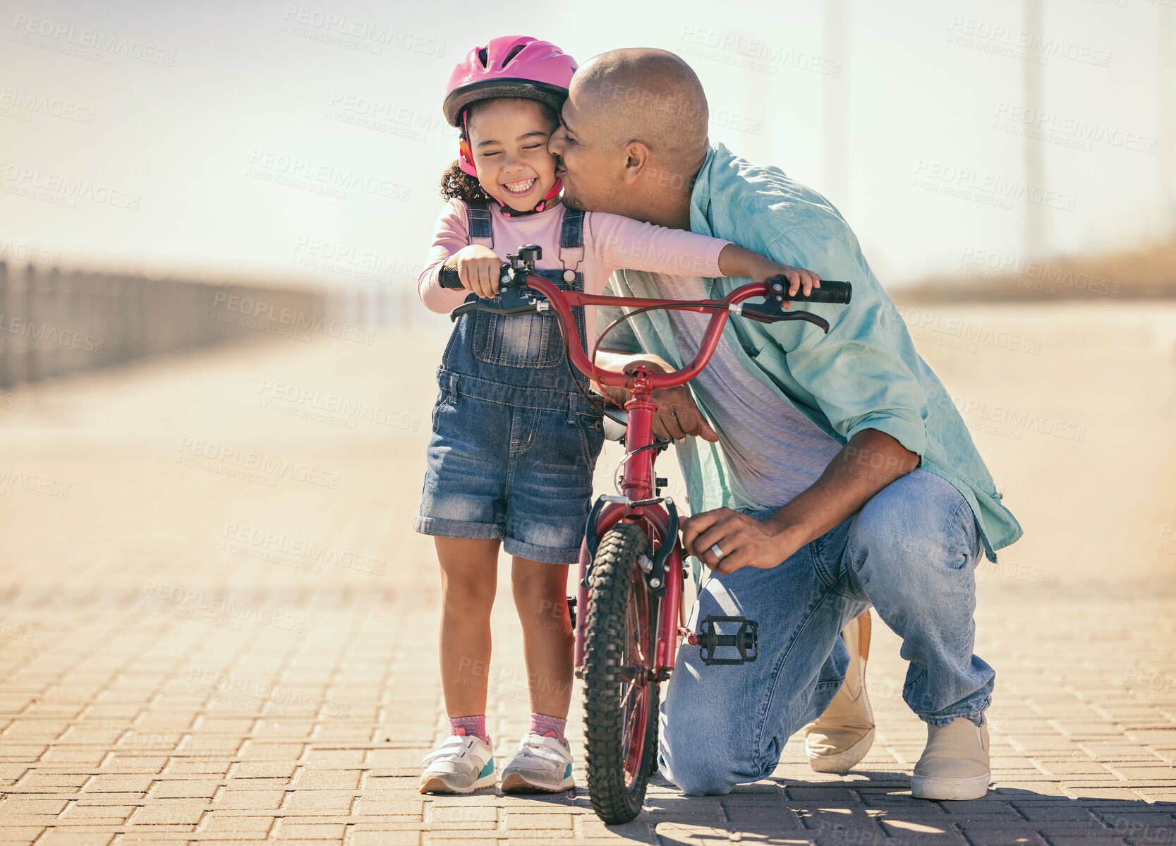 Buy stock photo Father, child and kiss while outdoor with a bicycle with a girl learning, development and training on a bike in summer for fun, love and quality time. Man teaching kid to ride at a park on vacation