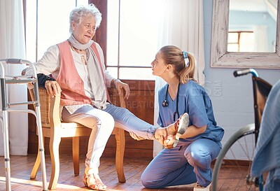 Buy stock photo Senior woman, rehabilitation and help for foot injury, disability or pain in nursing home. Physiotherapist, doctor and treatment for feet, ankle or legs with physical therapy, elderly care and nurse