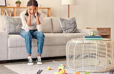 Buy stock photo Black woman, headache and mental health, stress and anxiety while depressed on sofa in home living room. Stressed female, mistake and sad, head pain and tired of burnout problems on couch in home
