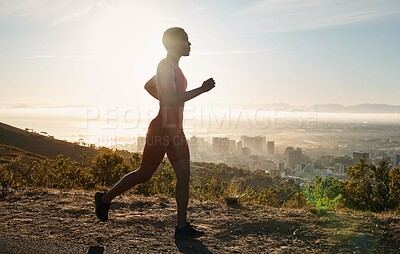Buy stock photo Mountain running, fitness and black woman training for marathon, sports competition and race in South Africa. Cardio, exercise and African girl runner with music for workout motivation in nature