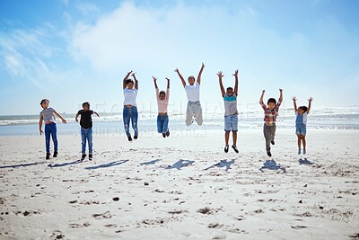 Buy stock photo Big family, beach jump and adventure for holiday, sky and bonding for interracial diversity by waves. Happy family, mom and jumping with hands in air for solidarity, care or love on vacation by sea