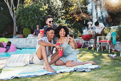 Buy stock photo Friends, party and picnic in summer, selfie and fun together for break, relax and smile outdoor, playful or bonding. Young people, men or woman with smartphone, share picture or celebration in garden