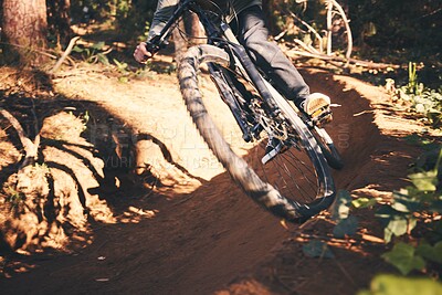 Buy stock photo Cycling, closeup and wheel with man in nature for fitness, training and adventure. Extreme sports, speed and cardio with male cyclist on bike in forest park for travel, challenge and performance