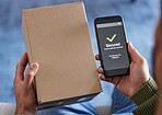 Cardboard box label, phone screen or person hands with security check success, safety scan or export order verification. Tick, mail or home client with mobile app, retail delivery or shopping product