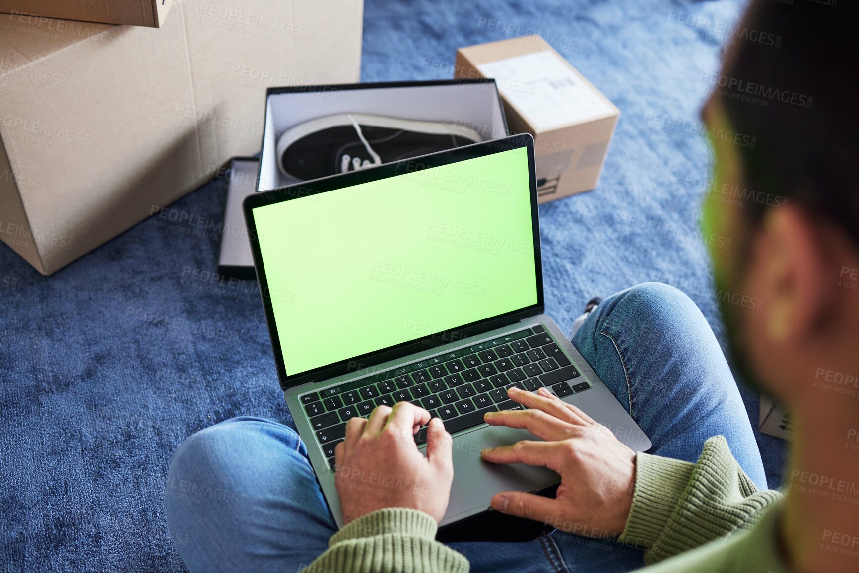 Buy stock photo Online shopping, man with laptop, green screen and boxes on floor, shoes and delivery service on digital app. Sale, discount and ecommerce on fashion retail brand website, internet search on computer