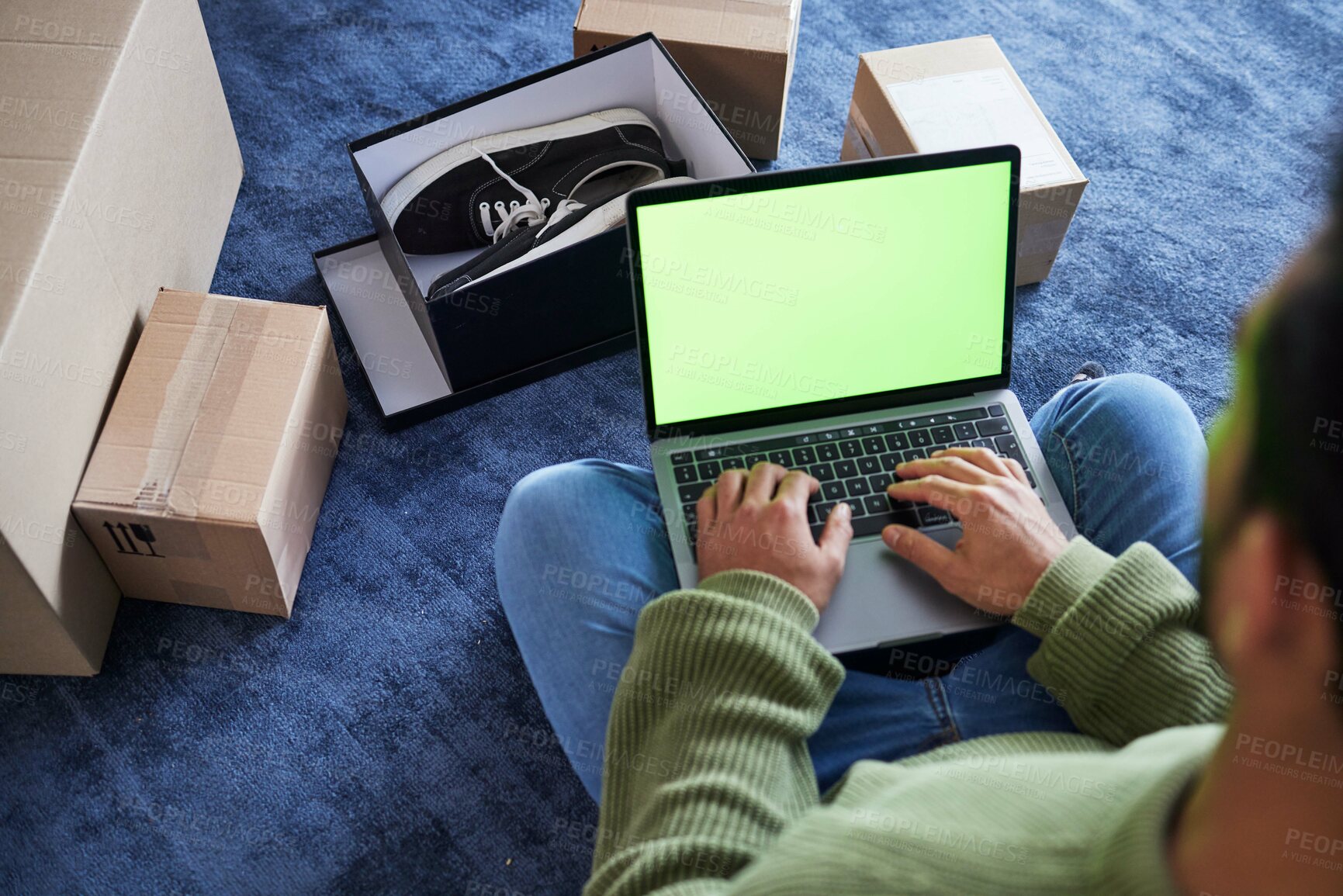 Buy stock photo Online shopping, man with laptop, green screen and package on floor, shoes and delivery service on digital app. Sale, discount and ecommerce on fashion retail website, internet search on computer.
