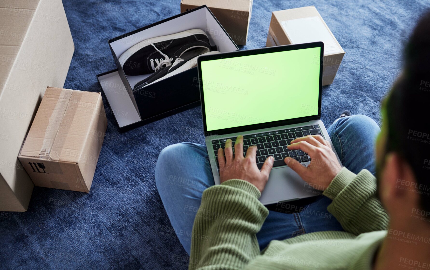 Buy stock photo Ecommerce, man with laptop, green screen and boxes on floor, shoes and delivery service on digital app. Sale, discount and online shopping on fashion retail brand website, internet search on computer