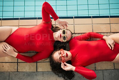 Buy stock photo Sunglasses, swimwear and fashion women or friends in red bodysuit at indoor swimming pool. Portrait above young people relax with sports aesthetic, style and art or luxury in designer clothes