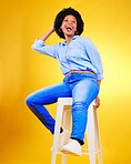Black woman, smile and portrait on a chair in studio, yellow background or natural happiness with casual fashion and style. African, gen z or model relax with laugh for creative, mockup or space