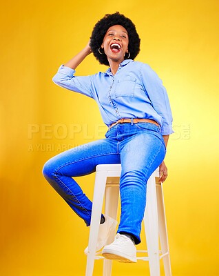 Buy stock photo Black woman, smile and portrait on a chair in studio, yellow background or natural happiness with casual fashion and style. African, gen z or model relax with laugh for creative, mockup or space