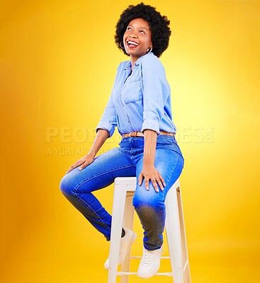 Buy stock photo Black woman, smile and thinking on a chair in studio, yellow background or natural happiness with casual fashion and style. African, gen z or model relax with ideas for creative, mockup or space