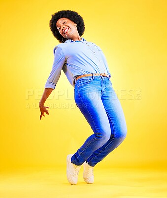 Buy stock photo Excited, happy and a woman tiptoe in studio with fun energy, positive attitude and action. Portrait of African model person isolated on yellow background for freedom dance, winner or celebration