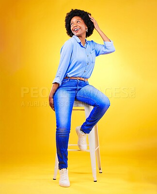 Buy stock photo Black woman, thinking and smile on a chair in studio, yellow background or natural happiness with casual fashion and style. African, gen z or model relax with ideas for creative, mockup or space