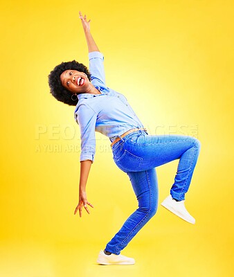 Buy stock photo Excited, crazy and a woman in studio with fun energy, positive attitude and balance. Happy African model person isolated on yellow background for freedom dance, winner or wow celebration of success