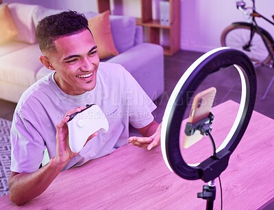 Buy stock photo Review, live streaming and man gamer talking of console controller on social media for connection on vlog. Ring light, influencer and content creator or person speaking on internet show as host