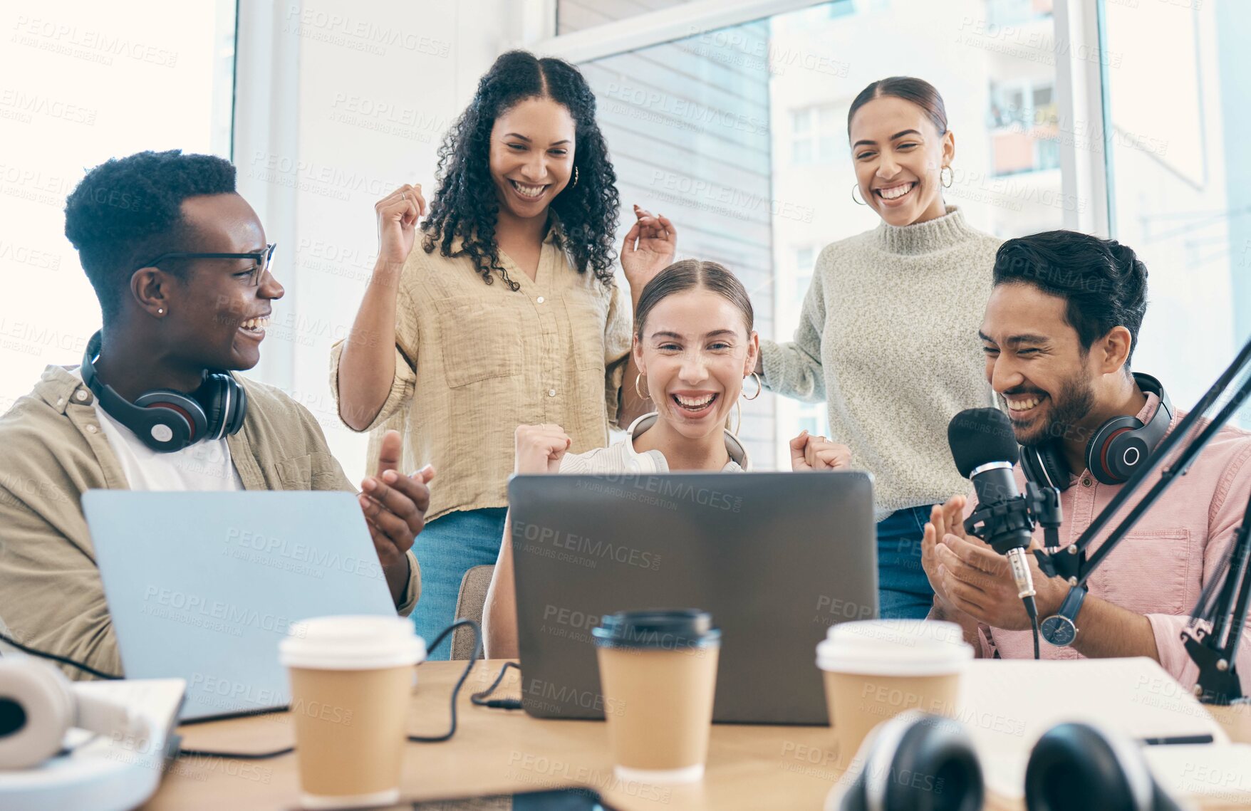 Buy stock photo Celebration, radio group and staff with applause, laptop and prize with internet, giveaway and collaboration. Happy people, men and women with a podcast, connection and achievement with cooperation