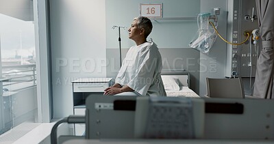 Buy stock photo Sad, patient and thinking in hospital with window and stress, anxiety or fear of cancer, death and insurance. Senior, woman and depression in clinic with lady worried for future or mental health