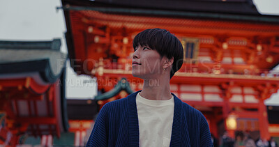 Buy stock photo Man, Japanese and religious temple for travel location or traditional respect, ritual or prayer. Male person, thinking and outdoor journey at holy worship shrine for Tokyo adventure, peace or god