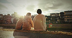 Friends, sitting and talking in city on sidewalk with travel, gen z and happy discussion together in japan. People, bonding and back in tokyo town on vacation and holiday with wellness by water canal