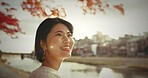 Woman, outdoor and thinking with ideas, smile and happy with wonder, daydreaming and nature. Japanese person, park and girl with decision, opportunity and wonder with thoughts, choice and excited