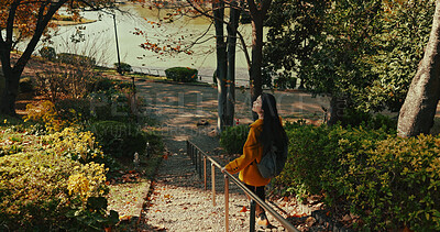 Buy stock photo Japanese, park and woman from back walking and travel on vacation, adventure and explore path with trees. Gen z, student and happy journey on holiday in nature, forest and trail in Kyoto woods