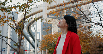 Buy stock photo Thinking, Japanese woman and outdoor in city for travel by train in autumn with trees and happiness. Park, nature and business person in Tokyo to commute in morning on subway metro transportation