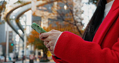 Buy stock photo City, hands and woman with phone for typing on social media, download digital app and scroll notification. Closeup, smartphone and mobile contact in urban street to search for travel location online 