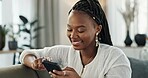 Home, smile and black woman on a couch, smartphone and connection with social media, post and typing. African person, apartment or girl on sofa, cellphone or mobile user with internet and network