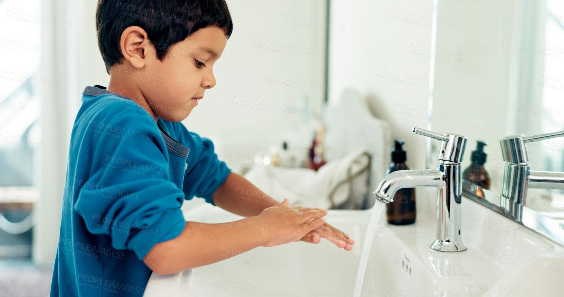 Buy stock photo Young boy, washing hands and hygiene for health, sustainability and water at routine at home. Male child, bathroom and clean with soap, foam and sink in healthy with hand washing and disinfection