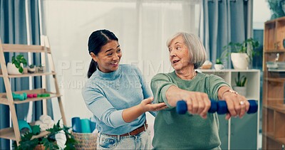 Senior care, physiotherapy and caregiver with old woman, dumbbell and healthcare at nursing home. Physio, exercise and retirement, fitness coach and elderly patient with mobility training in office.