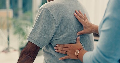 Hands of physiotherapist, massage or physiotherapy for back pain to help in physical therapy rehabilitation. Chiropractic closeup, chiropractor or physiotherapist healing spine, body or muscle injury