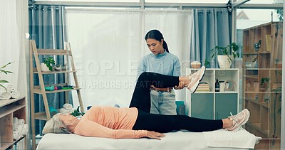 Physiotherapist, rehabilitation or old woman stretching knee to help in physical therapy for mobility exercise. Elderly person, chiropractor or physiotherapy healing workout for legs or muscle injury