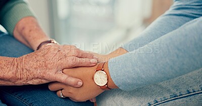 Support, senior or closeup of people holding hands for comfort or compassion while sitting together. Trust, sympathy or old woman praying, bonding and healing after death with person or psychologist