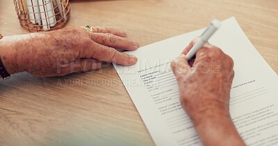 Hands, sign or woman with contract, application or document for will, life insurance or divorce papers. Zoom, closeup or person writing signature for paperwork, form or title deed agreement on table