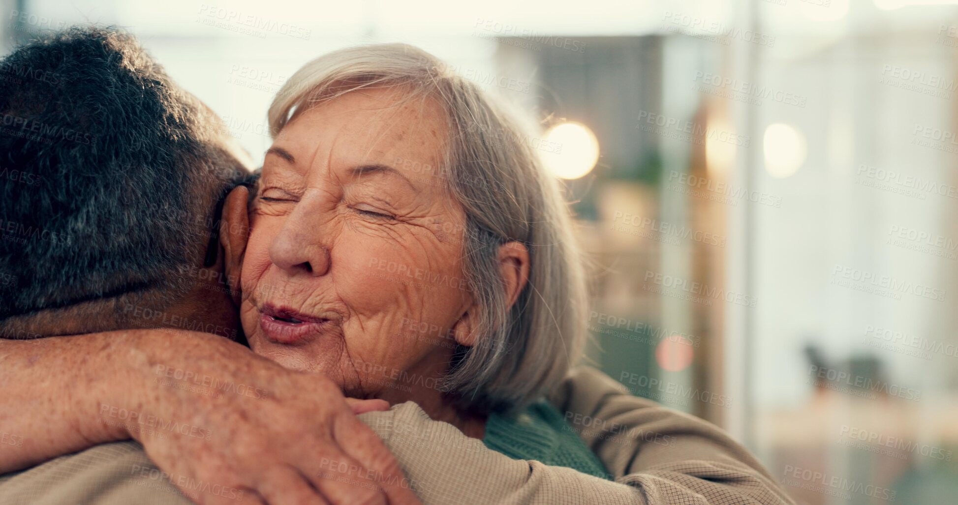 Buy stock photo Love, hug and an elderly couple in their home together for support, marriage or care with retirement. Relationship, smile or happy with a senior woman and old man embracing for romance in their house