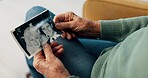 Photograph, hands and memory of a person on a home sofa for nostalgia, history and to remember. Senior adult with pictures and thinking of old album, nostalgia and wedding photography in retirement