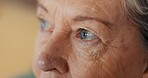 Eyes, thinking and senior woman at nursing home with fear, stress or worry, grief or depression closeup. Anxiety, face and elderly lady sad with nostalgia, doubt or dementia, memory loss or Alzheimer