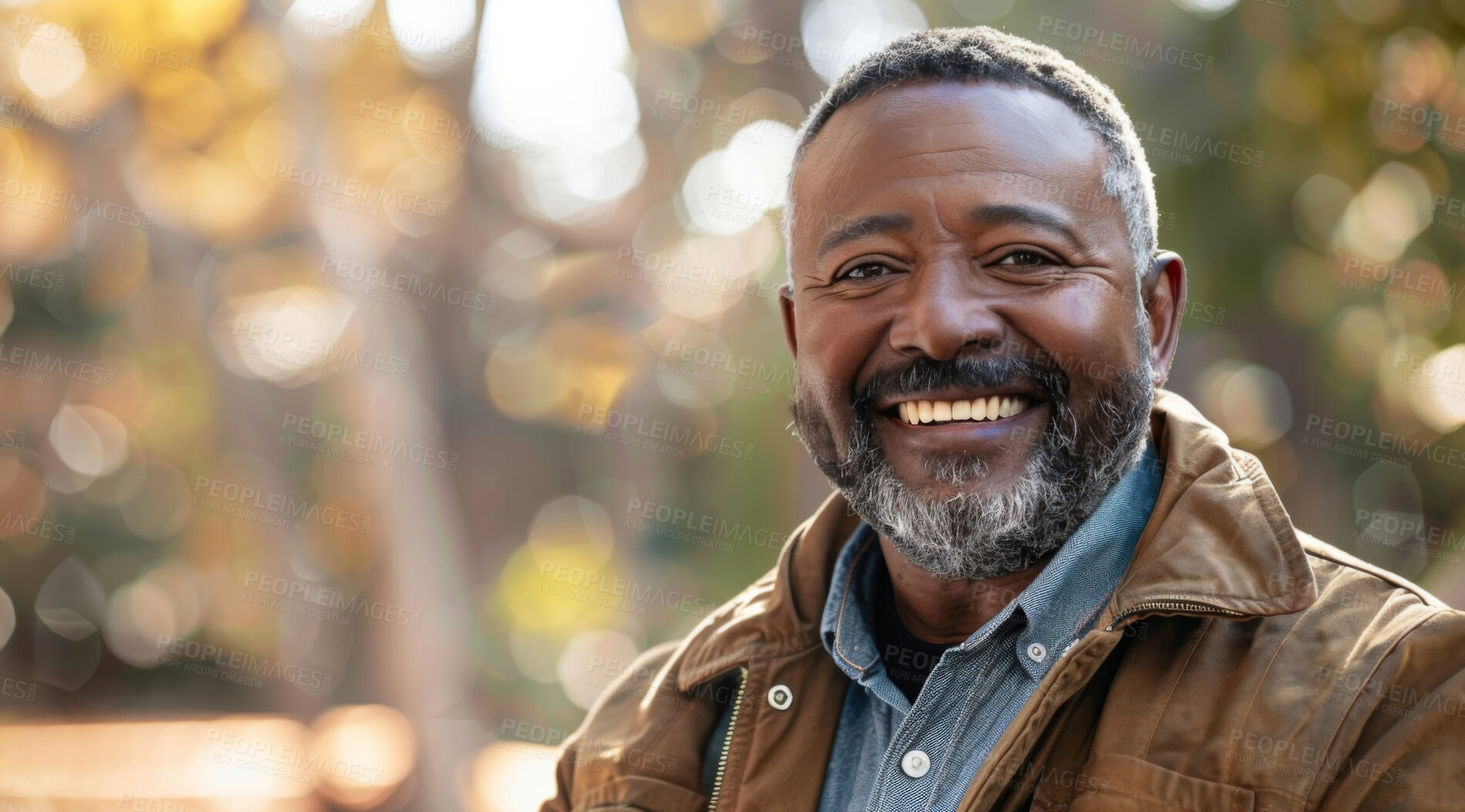 Buy stock photo Mature, man and portrait of a male laughing in a park for peace, contentment and vitality. Happy, smiling and african person radiating positivity outdoors for peace, happiness and exploration