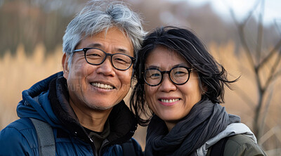 Buy stock photo Mature, couple and portrait of a man and woman posing together for love, bonding and dating. Happy, Asian and romantic people radiating positivity outdoors for content, happiness and exploration