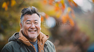 Mature, man and portrait of a male laughing in a park for peace, contentment and vitality. Happy, smiling and chinese person radiating positivity outdoors for peace, happiness and exploration