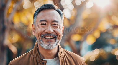 Mature, man and portrait of a male laughing in a park for peace, contentment and vitality. Happy, smiling and chinese person radiating positivity outdoors for peace, happiness and exploration