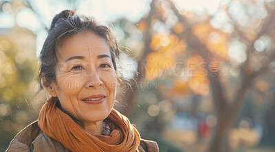 Mature, woman and portrait of a female laughing in a park for peace, contentment and vitality. Happy, smiling and chinese person radiating positivity outdoors for peace, happiness and exploration