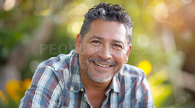 Mature, man and portrait of a male laughing in a park for peace, contentment and vitality. Happy, smiling and hispanic person radiating positivity outdoors for peace, happiness and exploration