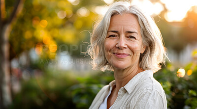 Mature, woman and portrait of a female laughing in a park for peace, contentment and vitality. Happy, smiling and confident person radiating positivity outdoors for peace, happiness and exploration