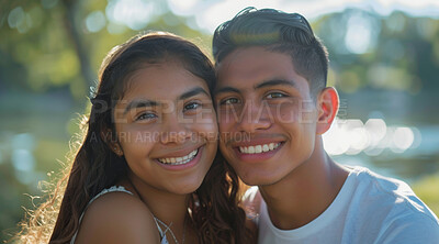 Young, couple and portrait of a man and woman posing together for love, bonding and dating. Happy, hispanic and romantic people radiating positivity outdoors for content, happiness and exploration