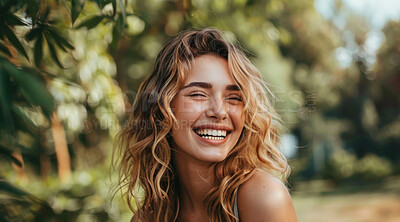 Young, woman and portrait of a female laughing in a park for peace, contentment and vitality. Happy, smiling and confident person radiating positivity outdoors for peace, happiness and exploration