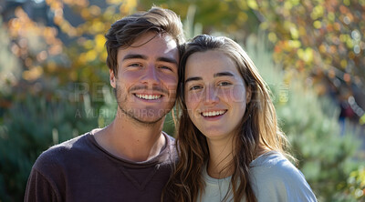 Young, couple and portrait of a man and woman posing together for love, bonding and dating. Happy, smiling and romantic people radiating positivity outdoors for content, happiness and exploration
