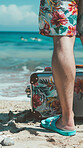 Man, anonymous and legs walking on beach during  summer vacation in Hawaii with luggage, close up and cropped background. Relaxation with male or youth on tropical holiday adventure in nature